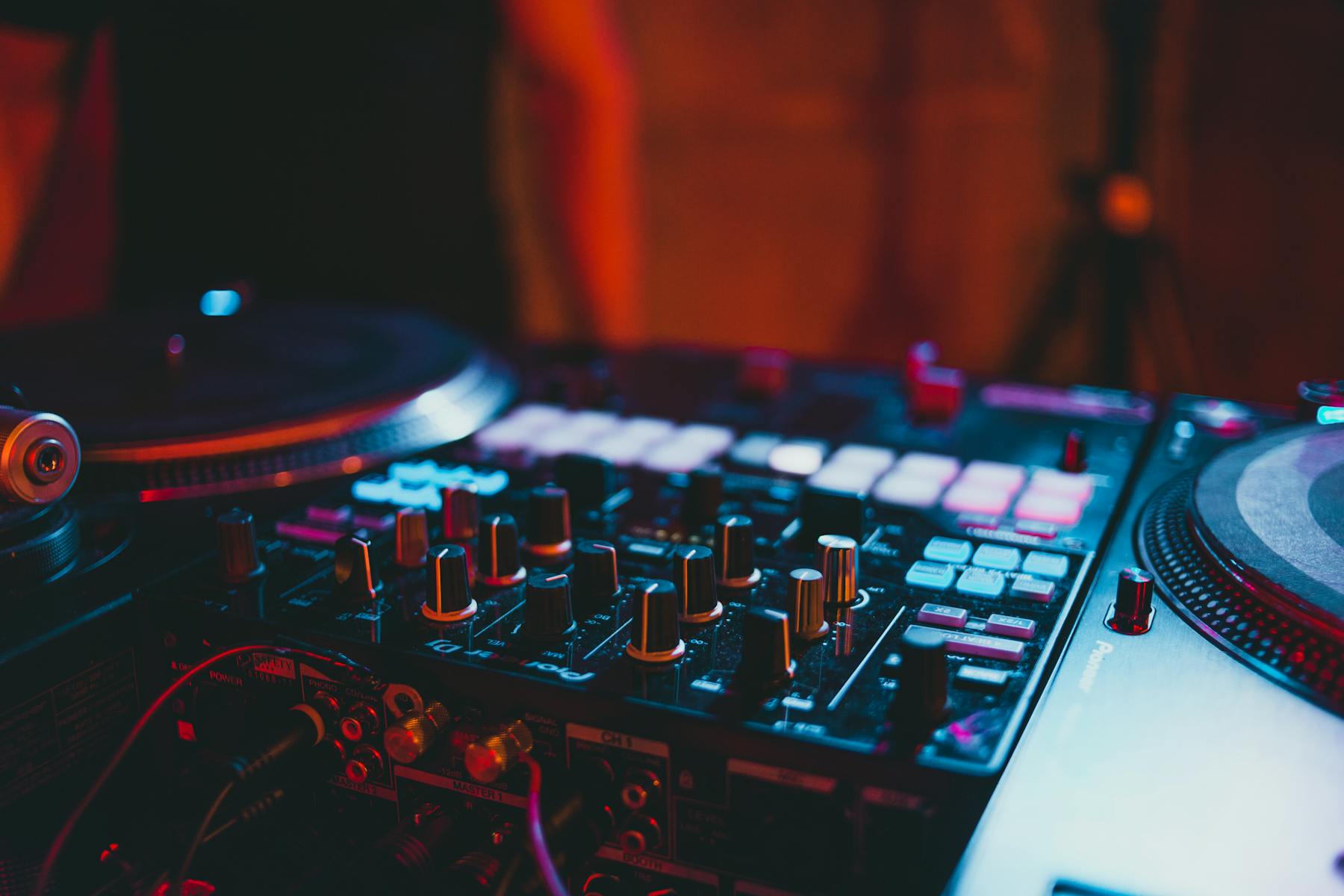 Professional DJ booth with club lighting